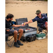 A rugged black portable power station with integrated carrying handles and a digital display screen. The front panel features various power outputs, including standard AC outlets, multiple USB ports, and dedicated DC inputs.